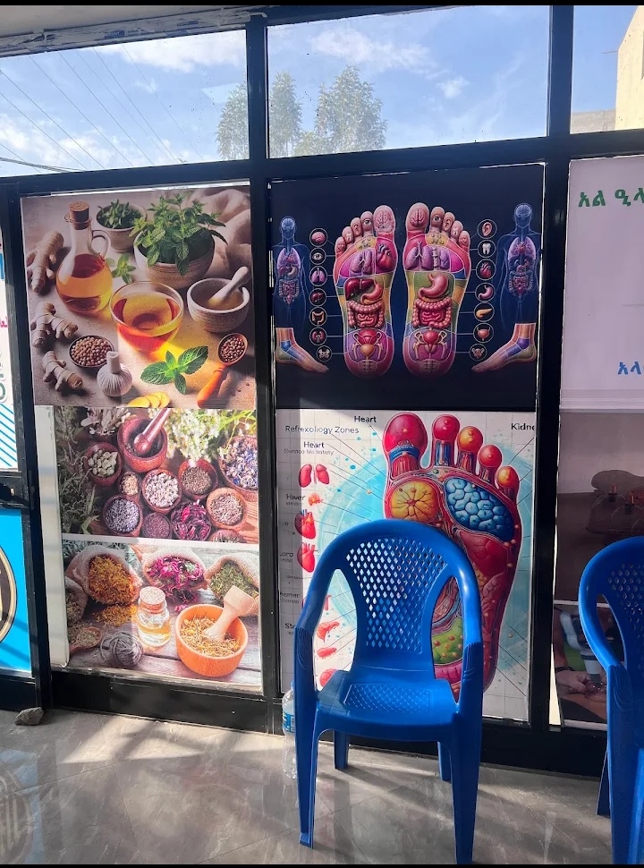 Herbal medicine and reflexology posters inside the center